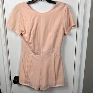 Hyfve peachy pink deep v back short sleeve romper.  Size small